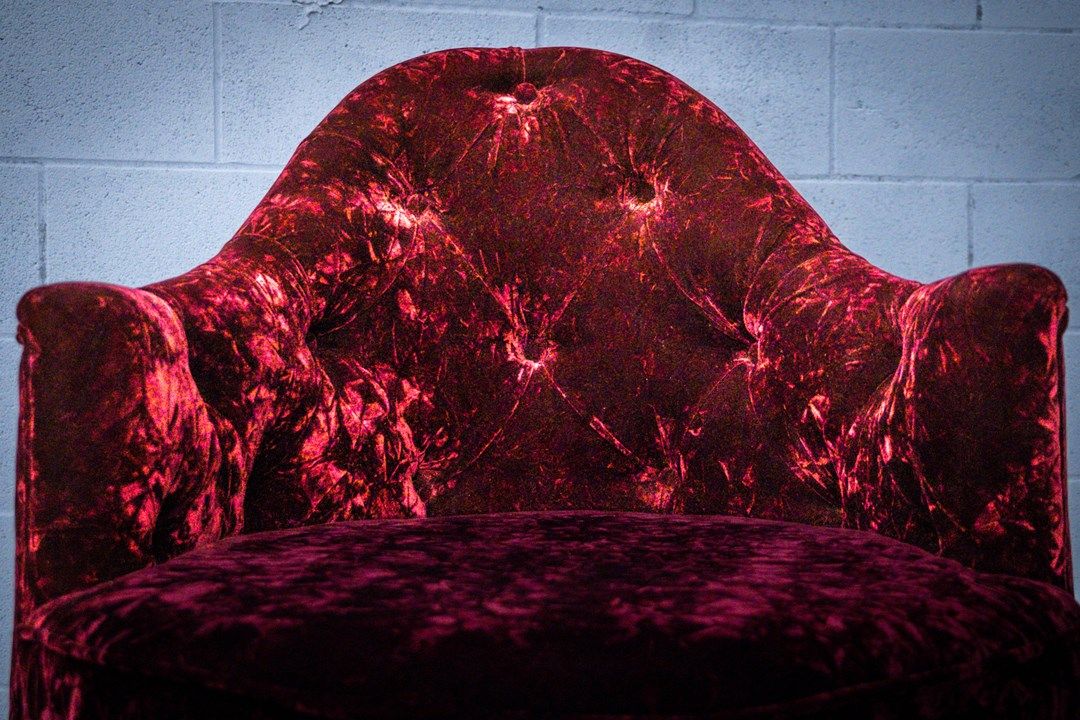 round chair gallery in red velvet tufting front view