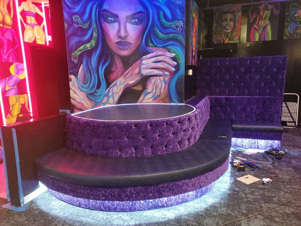 island couch with tufting in a night club